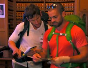 Rob Goddard and Ryan Steele look through thousands of book on the Finale of The Amazing Race Canada 2