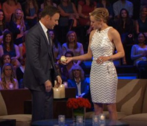 Ashley Salter presents Chris Harrison with an onion on The Bachelor 19 Women Tell All