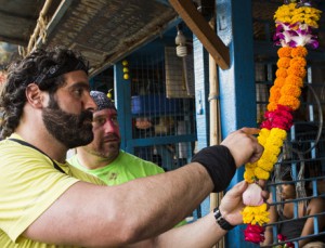 Nick Foti and Matt Guinta make a flower garland on Amazing Race Canada 3