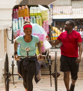 Simi Fagabongbe and Ope Fagabongbe navigate the crowed streets of Kolkata India on the Amazing Race Canada