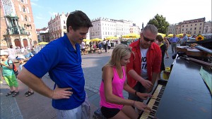 "Krakow, I'm Gonna Get You"--In Detour B, Joey (left) and Kelsey (center) must earn 100 Zloty, the Polish currency, by performing a piece of music on a piano in Krakow's Old Town Square in order to receive the next clue on THE AMAZING RACE, Friday, Nov. 13 (8:00-9:00 PM, ET/PT) on the CBS Television Network. Photo: CBS ÃÂ©2015 CBS Broadcasting, Inc. All Rights Reserved